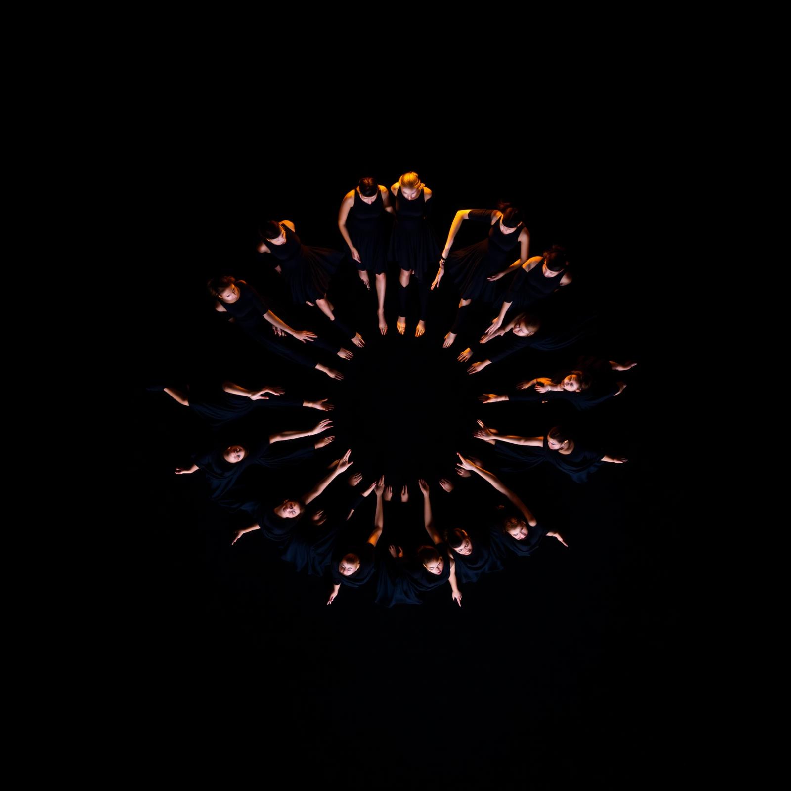 Radial formation of dancers seen from above